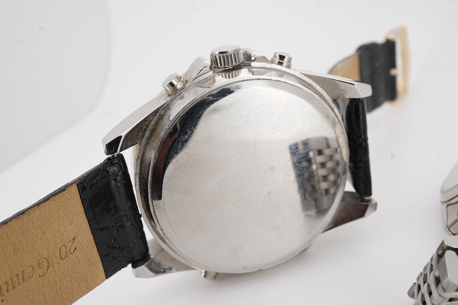 A gentleman's 1980's stainless steel Omega Seamaster quartz wrist watch, with baton numerals and date aperture, case diameter 33mm, (glass cracked), on a stainless steel Omega bracelet, no box or papers, together with on